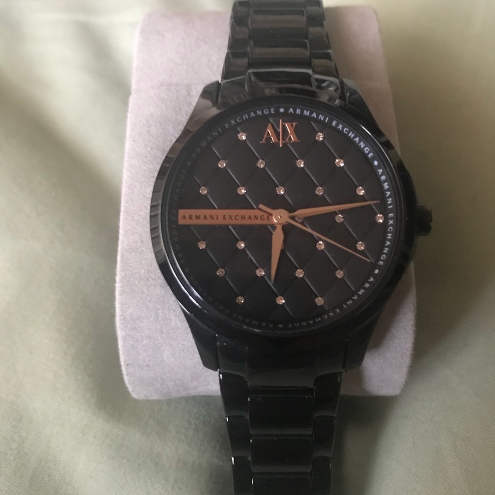 AX women’s black and gold watch